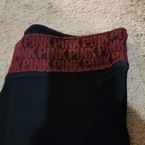 Victoria's Secret Pink Black leggins with pink written all over the waist band.